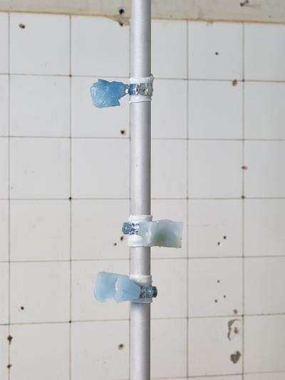 Spillover, 2020. 
Paraffin wax, pigment, silicone, sandblasted aluminum, steel. H: Flexible. 
