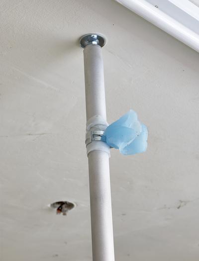 Spillover, 2020. 
Paraffin wax, pigment, silicone, sandblasted aluminum, steel. H: Flexible. 
