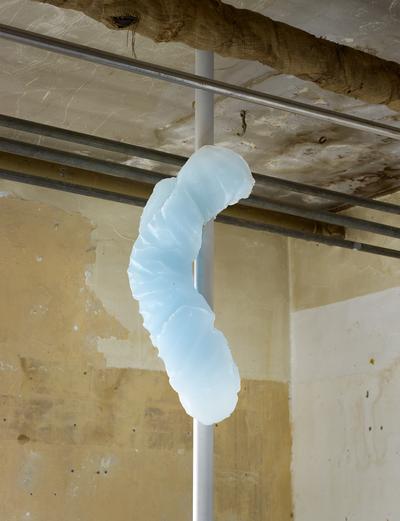 Spillover, 2020. 
Paraffin wax, pigment, silicone, sandblasted aluminum, steel. H: Flexible. 
