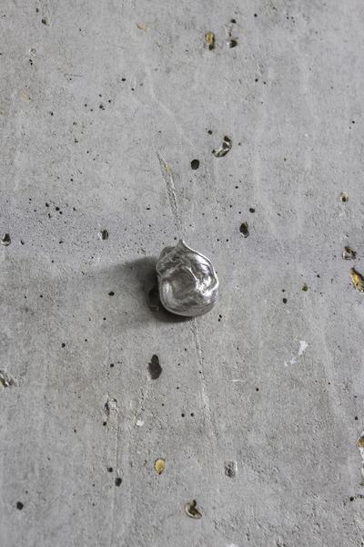 Monuments, 2026. Tin cast of chewing gum. 
